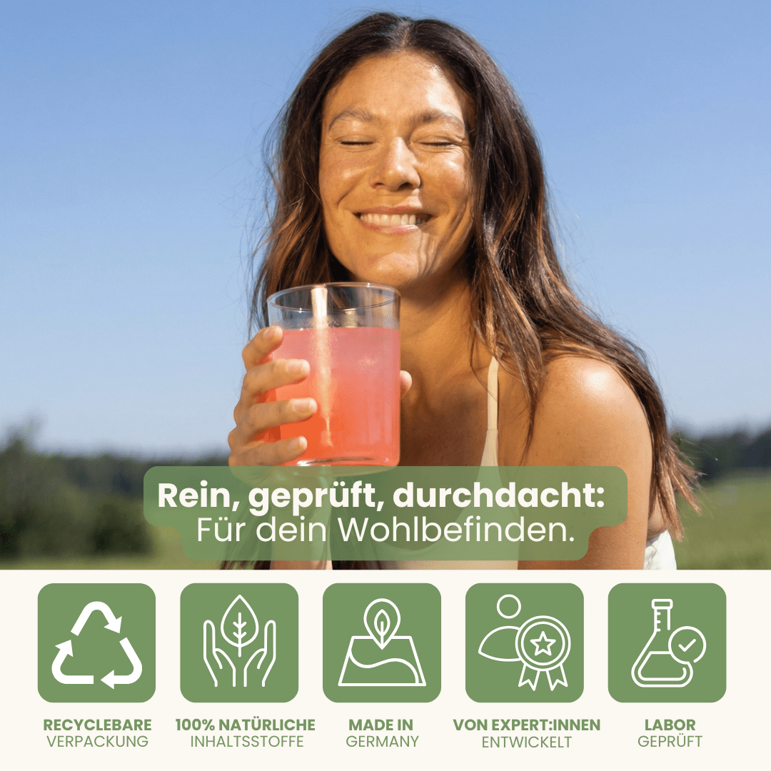 Stoffwechsel Set mit Qualitätssiegeln Made in Germany bei Frau mit Vedi Boost Drink in der Natur